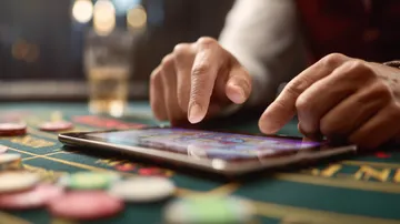 A glowing roulette wheel with cascading chips, symbolizing the engaging live and instant-win games available on LUCK789.